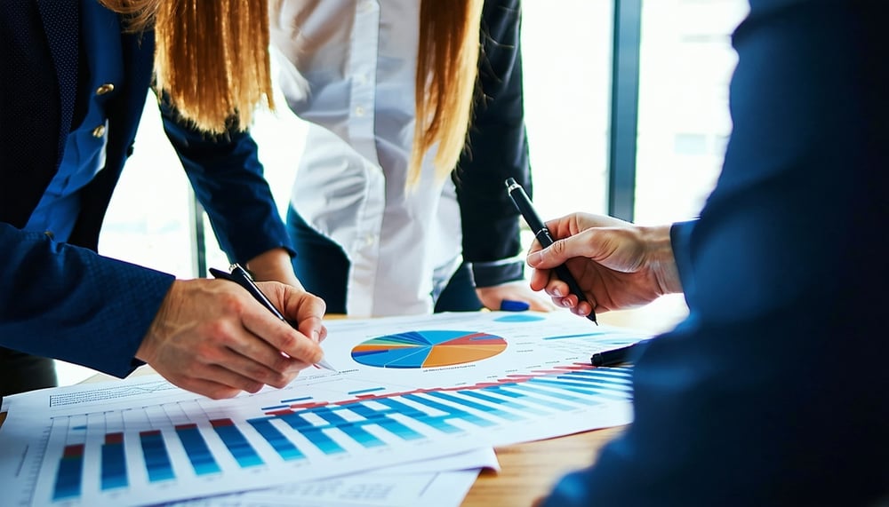 Business professionals analysing survey data charts
